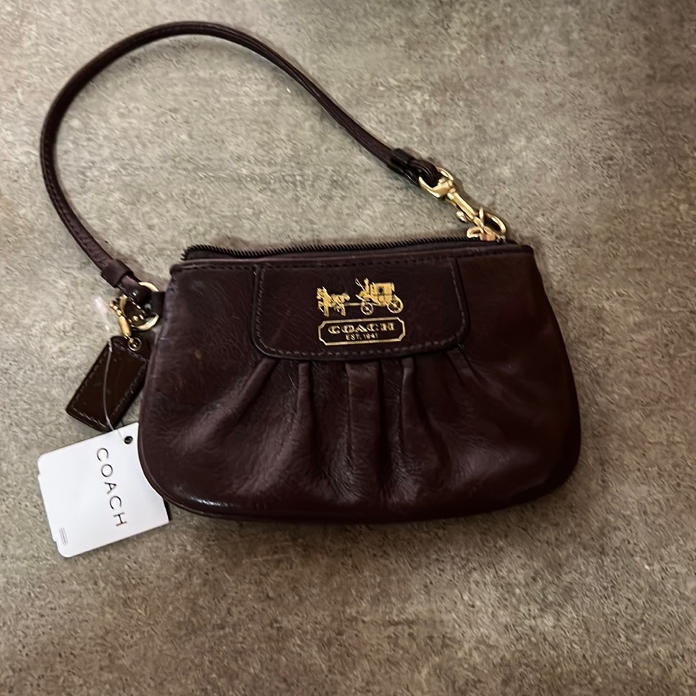 Brown coach leather wristlet. NWT